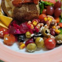 Baked potato with hummus & sun dried tomatoes at Cafe U in Kelso