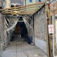 Back ally entrance, no reason to go inside if you don’t want to or don’t feel comfortable  at Pizza Friendly Pizza in Chicago