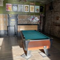 Pool table attached to pizza friend pizza and bar next door,  all same ownership  at Pizza Friendly Pizza in Chicago