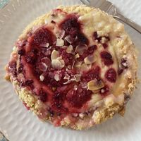 yeast cake with raspberries and cream  at Baja Wegańska Cukiernia in Warsaw
