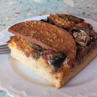 Pepperoni pizza slice at Baja Wegańska Cukiernia in Warsaw