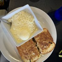 “Chicken” breakfast sandwich.. and those amazingly unhealthy, loaded grits!   at Black & Blue Diner in Las Vegas