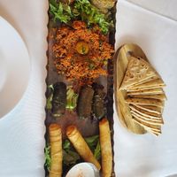 Tapas from top: Babaganoush, tabouli, dolmas, feta rolls with tazicki at Red Onion Organic in Destin