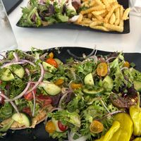 Veggie “sandwich “ with side salad. Falafel sandwich with fries at Red Onion Organic in Destin