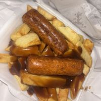 Chips and gravy with 2 sausage   at Milton Chippy in Stoke-on-trent