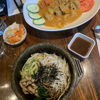 Complimentary kimchi, Classic stone bowl, “Beef” in spicy coconut sauce 😋  at Franchia Vegan Cafe in New York City