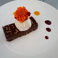 Snickers slice with vanilla ice cream - all vegan at The Phoenix in Tauranga