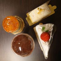 Soleil (upper left), Lemon Roll Cake (upper right), Tiramisu (lower left), and Strawberry Shortcake (lower right)  at Marbre Vegan in Tokyo