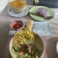Khao Soi and Massaman Curry with rice. Also spring rolls, but we already ate two of those before taking a photo 🙈  at Vegan Society in Chiang Mai