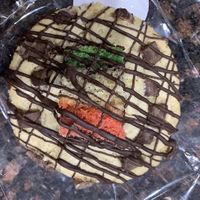 Chocolate chip cookie stuffed and topped with a rainbow cookie  at Bliss Bites Cookies - Maybe closed in Beaufort