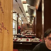 sitting on mats without our shoes on  at HanGawi in New York City