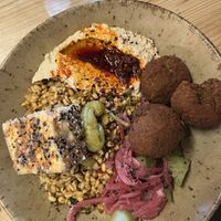 Hummus & broken falafel bowl with tofu   at Caravan in North London