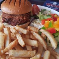 Bangkok bad boy burger with chips and salad at The Top House in Filey