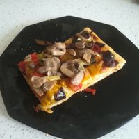 Pizza Ortolana.
Rizza with mushrooms, peppers, eggplants and artichokes at Panificio Parisi in Naples