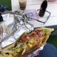 The vegan breakfast burrito is full of flavour , silky eggz and good crunch, I wanted to call everyone I knew cause no one should miss out . The ice coffee was well on point too.  at Twinkle Town  in Port Douglas