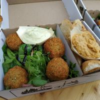 Salad with hummus, tatar sauce, pieces of toast and falafel. All in a take-out box. at Vegánsky Gazda in Trencin