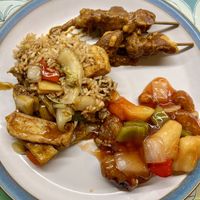 Mix of sweet and sour, satay skewers and special fried rice   at Lee's Kitchen in Bedford