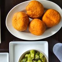 fried dumplings - DELICIOUS. but i recommend dipping it into the ital stew.  at Jamaican Breeze Sports Bar & Grill in Indianapolis