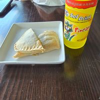 Jamaican vegan patties with a pineapple drink. Very tasty! make sure to order the vegan patties.  at Jamaican Breeze Sports Bar & Grill in Indianapolis