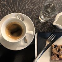 Coffee Americano and vegan berry cake  at Antico Caffè San Marco in Trieste