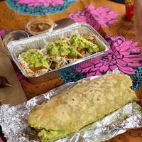 Burrito with vegan meat from seitan. In the background three taco’s with vegetables. Nice big portions! at Ulu Dos Tres Taco in Zanzibar