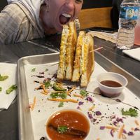 My non-vegan friend eyeing my vegan grilled cheese  at The Grilled Cheese Gallery in St Augustine