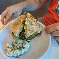 Vegan Black Bean Cheese Burger with potato salad  at The Hungry Caterpillar in Jacksonville