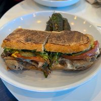 "Vegano Cubano" Oyster Mushroom Panini with a side of grape leaves at The Hungry Caterpillar in Jacksonville