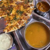 Half of our Jalapeno Tomato Gunpowder Uthappam. Very spicy but so good!  at Dosa Hut in Rocky Hill