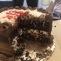 German chocolate cake cross-section  at Three Girls Vegan Creamery - Downtown in Guilford