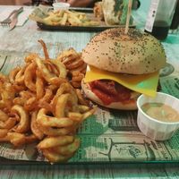 Meatball burger with curly fries at Bioloco in Madrid