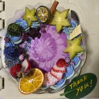 Raw cake with organic blueberry and Okinawan-grown dragonfruit filling, Okinawan-grown strawberries and cassis at Tamaya  in Ogimi