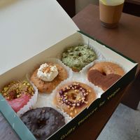 Box of 6 doughnuts (from clockwise) - raspberry pistachio, garlic cream, matcha crumble, tiramisu, peanut butter and jam, and chocolate hazelnut at O.verte Donuts 오베흐트 도넛 in Seoul