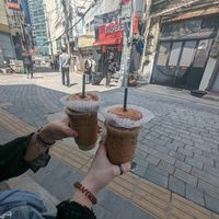 Vanilla latte with free happy hour doughnut at O.verte Donuts 오베흐트 도넛 in Seoul