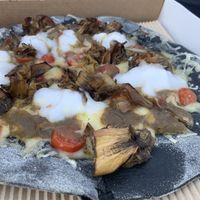 Pizza with artichoke and vegan mozzarella at Alpino in Paleo Faliro