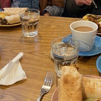 Two wraps (one falafel, one jackfruit) and breakfast bap with beetroot latte, cappuccino and tea at Vibes in Dorchester