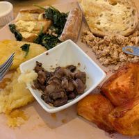 Yummy sausage, hash browns, tomatoes, spinach, tofu & homemade beans. at Vibes in Dorchester