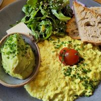 Scrambled tofu and extra avocado. The bread was remarkably good. at Mana Food - Moabit in Berlin