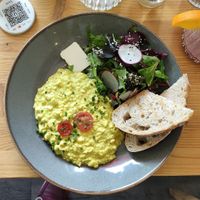 Scambled vegg (scrambled tofu, cherry tomatoes, side salad served with toasted bread) at Mana Food - Moabit in Berlin