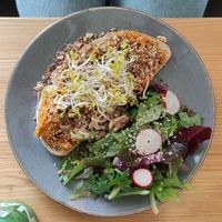 Spiced carrot (toasted sourdought topped with a baked carrot spread sprinkled with assorted spices (Fennel, cumin, walnuts) at Mana Food - Moabit in Berlin