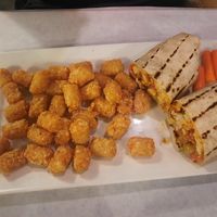 Vegan chicken wrap with side of tator tota at Vey's Pub & Grille in Hermitage