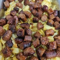 Salchichas al vino blanco con patatas at Saboro Comida Consciente in Castellon De La Plana