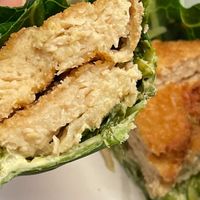 Crispy Chik"N Sandwich sub with Swiss Chard Wrap and added crispy onions at PLNT Burger in Alexandria