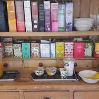 sorts of tea, cornflakes, fresh juice, fruits and soy joghurt at Claymore Vegetarian Guest House in Edinburgh