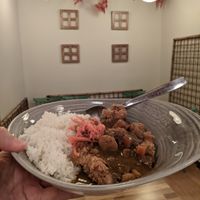 vegan curry with soy cutlet and rice at Okashi Sanda in Madrid