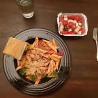Penne with meatballs and broccoli, garlic bread, and a salad of tomato & Barrett's Garden mozz. at SoCo Vedge in Narragansett