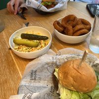 One house burger and one impressive burger, slaw and giant onion rings!   at Burger Fiancé in Montreal