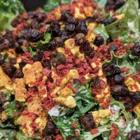 Kale Caesar Salad -
kale and romaine, house caesar dressing,
garlic croutons, red onions, fried capers at Burger Fiancé in Montreal
