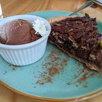 Pecan cake with chocolate ice cream at Bosque Urbano in San Jose