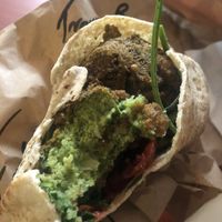Falafel on wholemeal with tomato cucumber salad with tahini at Kazbah in Kensington